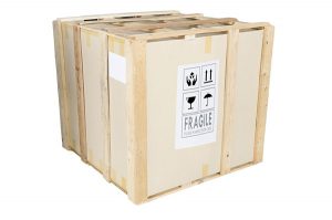 Secure wooden crate used for art moving and crating in NYC, labeled fragile for careful handling.