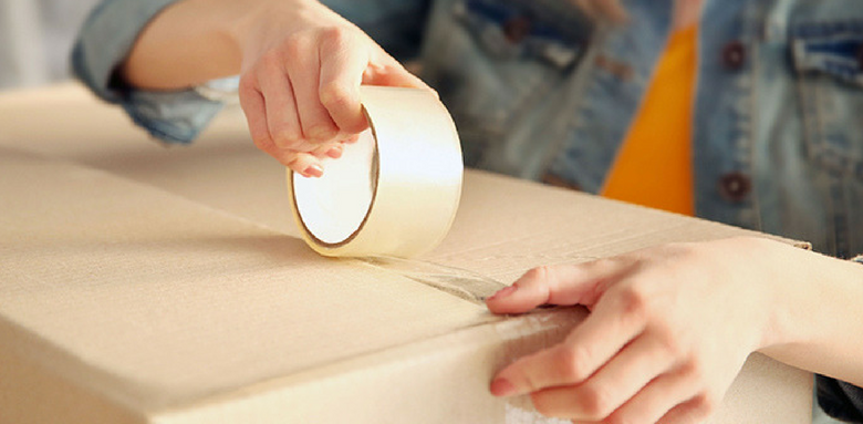 Shleppers Moving & Storage - Taping Up Boxes