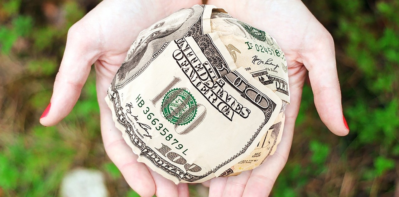 Hands With Ball Of Money