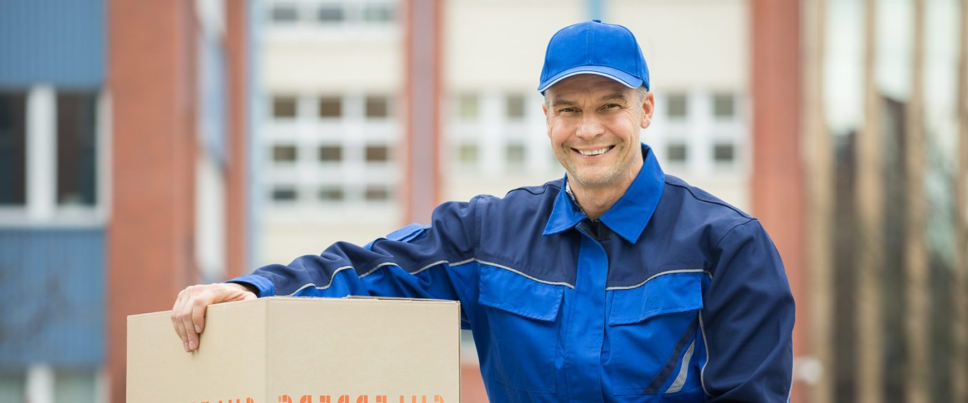 Guy Smiling With Moving Box