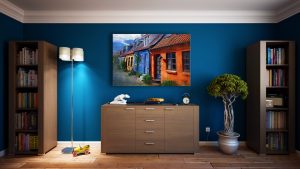 Blue Wall With Bookshelves, Plant, Lamp and Picture Frame