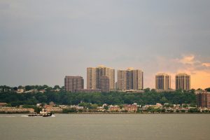 Big Pond With City In Background