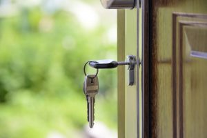 key in front door of house