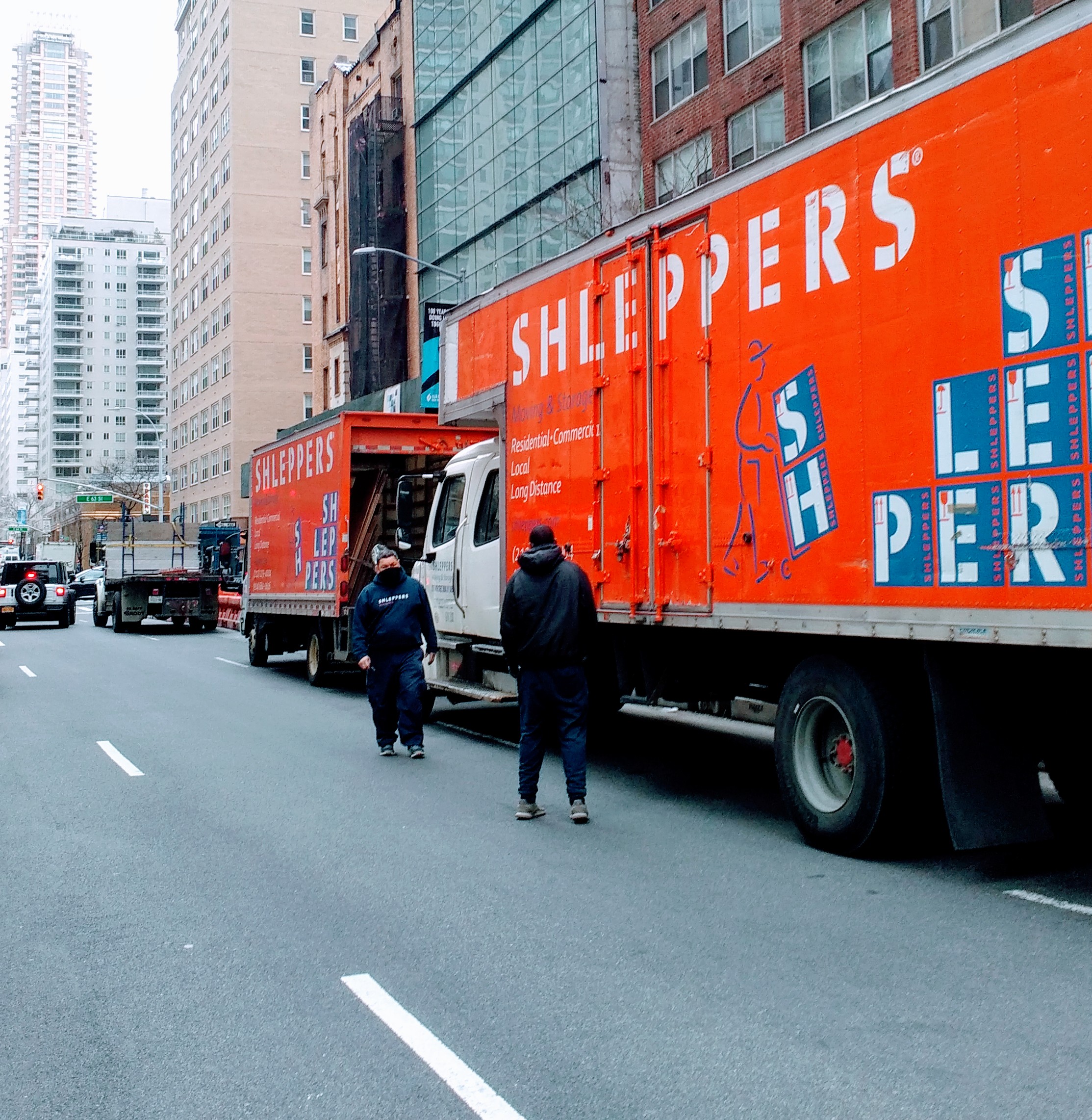 Shleppers moving truck on NYC street, helping with moving to Mount Morris Historic District in Harlem NYC.
