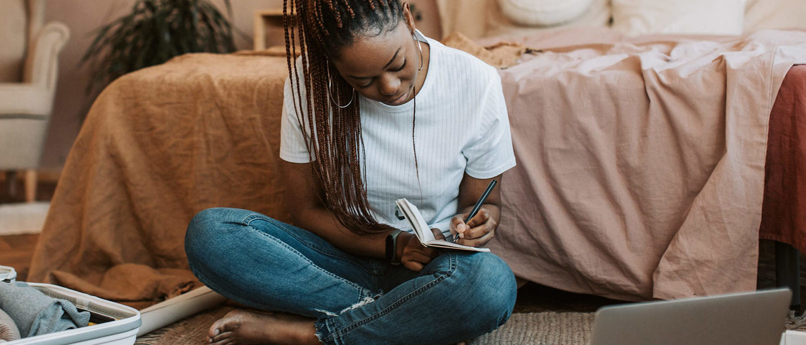 A woman making a list of what not to pack