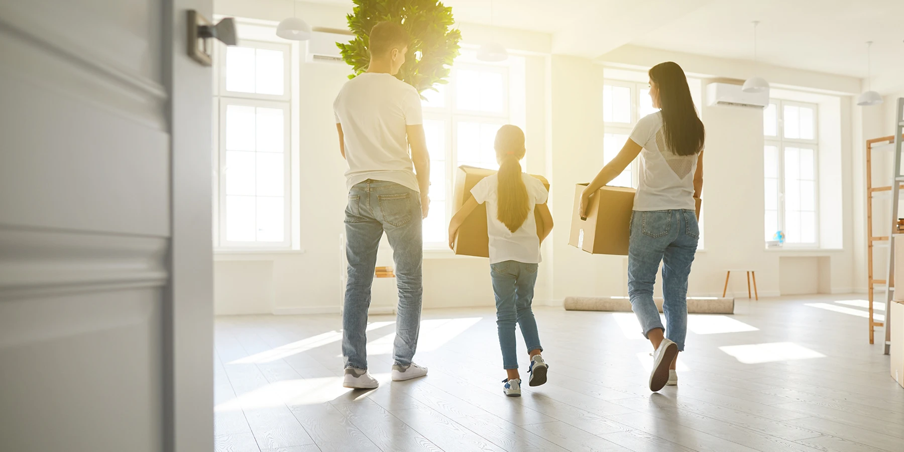Family moving into new home with boxes and household items delivered by licensed and insured NYC movers.