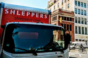 Shleppers moving truck in city location