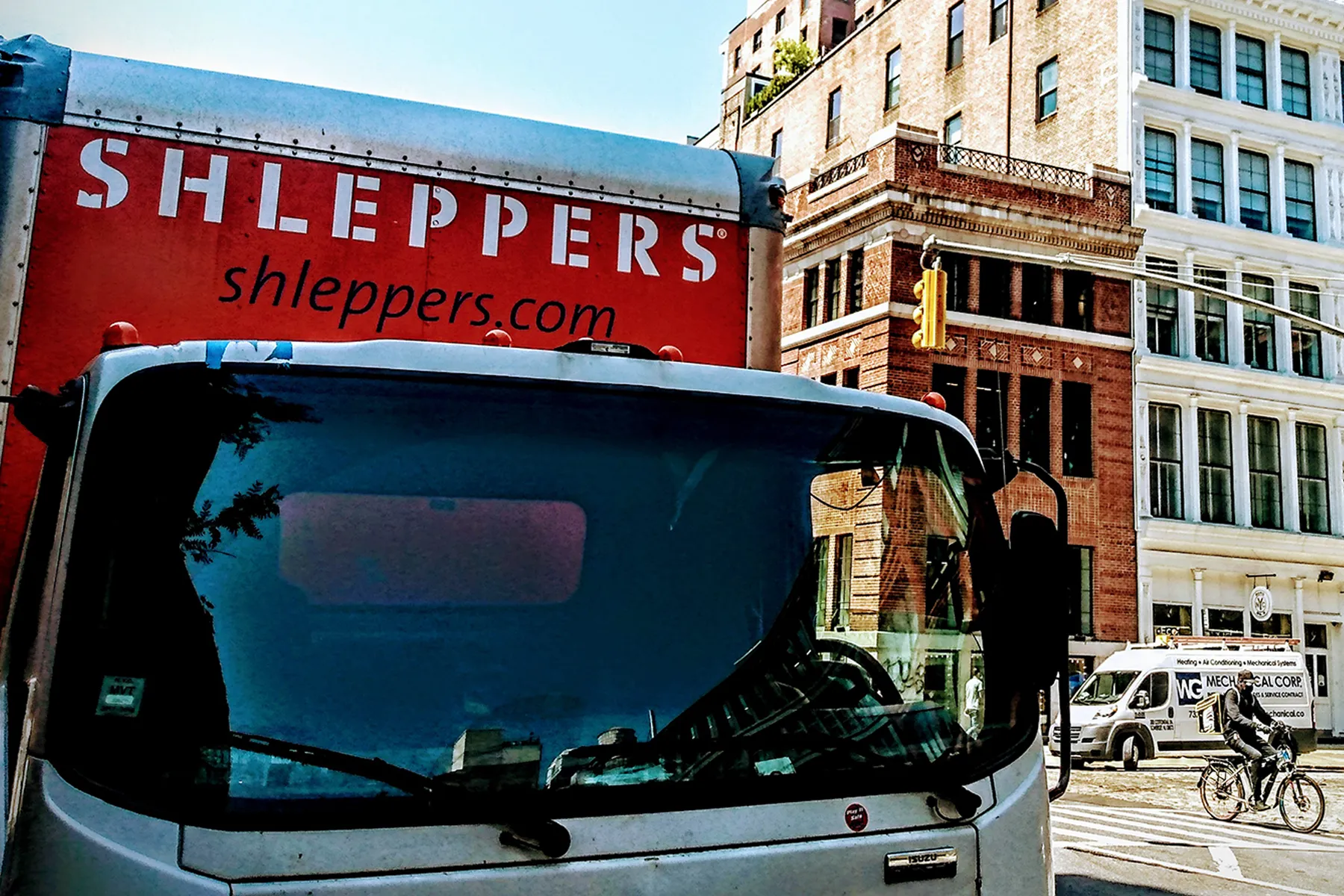 Shleppers moving truck in city location