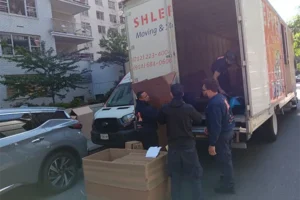 Movers loading boxes in truck